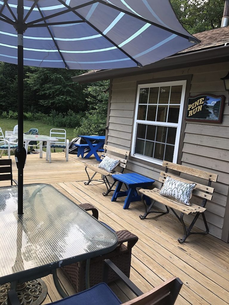 longer view of deck - umbrella table, picnic table, benches