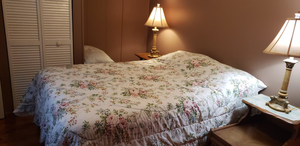 Front Bedroom with Full bed and two bed-side lamps