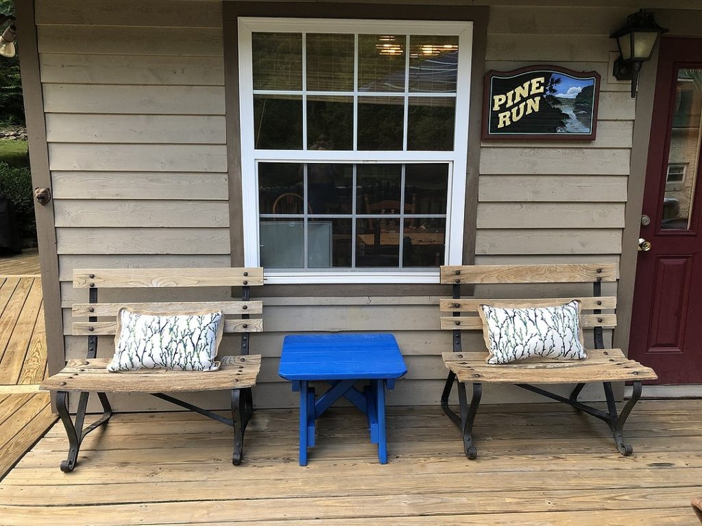 Front Deck- two benches and a blue table